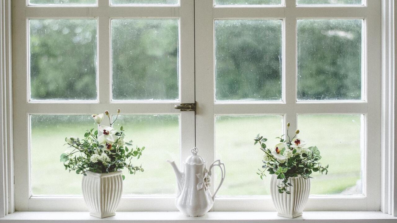 Porcelain teapot on windowsill